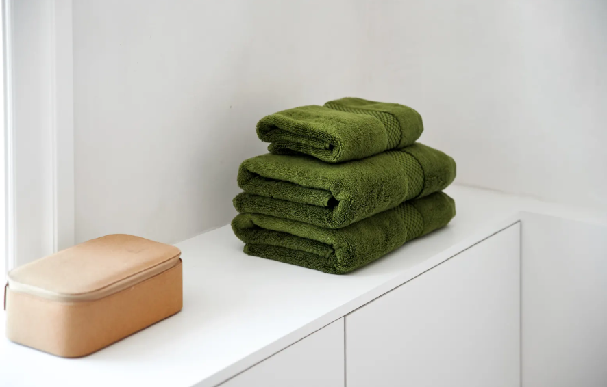 Mosegrønnehåndklær på soverom